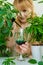 A woman drinks liquid chlorophyll. Selective focus.