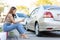 Woman drivers call insurance after a car accident before taking pictures and sending insurance. Online car accident insurance