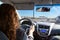 Woman driving car on highway, inside view