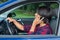 Woman driving car phoning with mobile phone