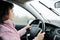 Woman driving car in rain