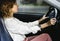 Woman driving a car on a road