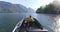 Woman Driving Motor Boat in Fjord Nature Landscape, British Columbia Near Bute, Toba Inlet, Strathcona, Campbell River