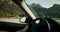 Woman driving vehicle on mountain road trip adventure hand closeup and dashboard