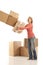 Woman dropping cardboard boxes
