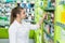 Woman druggist looking for medicaments in drugstore