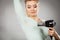 Woman drying armpit with hair dryer