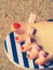 Woman drying her nail polish after pedicure