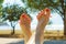 Woman drying her nail polish after pedicure