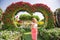 Woman in Dubai Garden portrait. Sunny day beautiful flowers backgrounds