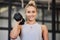 Woman, dumbbell and gym portrait of a athlete with a smile ready for training, exercise and workout. Sports, happiness