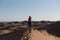 Woman in the dunes of the Sahara Dessert, Morocco