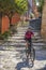 Woman with e bike on Elba Island, Italy