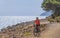 Woman with e bike on Elba Island, Italy