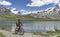 Woman on e mountain bike at Stelli lake above Zermatt, Switzerland