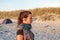 Woman with earphones at the beach