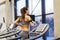 Woman with earphones exercising on treadmill