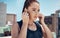 Woman, earphones and music in city for running, workout or fitness. Health, wellness and female from Canada ready for
