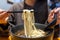 Woman eat Taiwan braised beef noodle