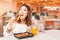 Woman eating asian bento lunch in foodcourt