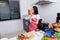 Woman eating a bread in kichen room