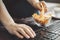 Woman eating chips from bowl at her workplace