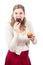 Woman eating chocolate donut and sweet muffin