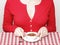 Woman eating chocolate strawberry fondue