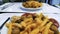 Woman eating delicious French fries and Swedish meatballs