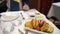 Woman eating delicious Indian food in the restaurant