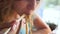 Woman eating delicious udon in an Asian cuisine restaurant. Woman eating noodles with vegetables and seafood with sushi