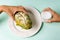 Woman eating durian shaped fruit bread