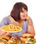 Woman eating fast food.