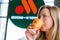 Woman eating fast food in Russian McDonalds Restaurant Vkusno I Tochka, Big Mac Menu, chicken nuggets new logo box