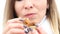 Woman eating fig fruit with pleasure, closeup