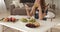 Woman eating fruits and desserts and drinking juice