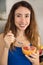 Woman eating grapefruit with a spoon