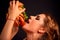 Woman eating hamburger. Student consume fast food.