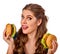 Woman eating hamburger. Student consume fast food on table.