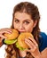 Woman eating hamburgers. Portrait of student consume fast food .
