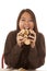 Woman eating handful of cookies