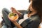 Woman eating a healthy bowl