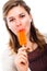 Woman eating ice lolly