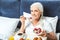 Woman eating oatmeal with berries