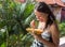 Woman Eating Papaya. Woman with fresh fruit papaya outdoors.