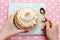 Woman eating pavlova cake (meringue)