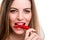 Woman eating pepper