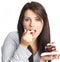 Woman eating piece of cake.