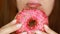 Woman eating a pink donut , delicious, sweet, sweet tooth. Diet. Dieting. Female mouth bites a dessert. Selective focus.