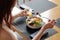 Woman eating poke bowl